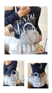 Light blue quilted bowling bag with pearl charm shown in a lifestyle model shot