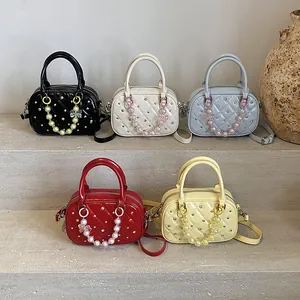 Quilted patent leather bowling bags in five colors with rhinestone details and beads