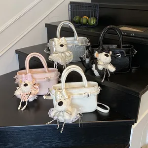 Sacs à main élégants en argent, rose et noir avec des breloques chiot mignonnes