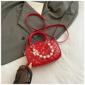 Red quilted mini bowling bag with pearl chain and shiny leather finish