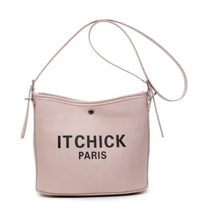 Pink canvas bucket bag with black ITCHICK PARIS lettering and adjustable strap