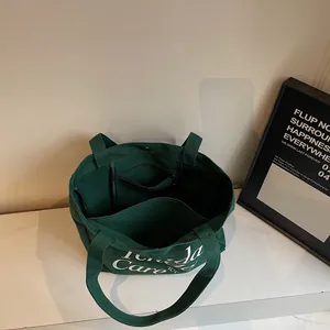 Borsa tote in tela verde scuro con stampa di lettere e ampi scomparti interni