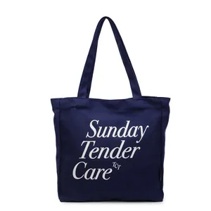 Borsa tote minimalista in tela blu navy con scritte artistiche bianche