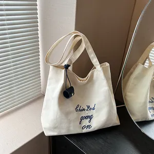 Sac Fourre-Tout en Toile Grande Capacité Femme Broderie de Lettres Minimaliste Sac à Bandoulière Pour École Travail Shopping Décontracté