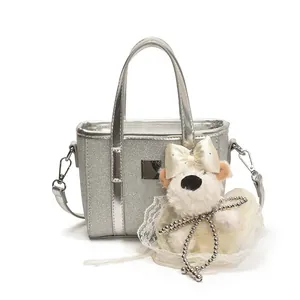 Silver sequin mini tote bag with crossbody strap and plush puppy charm for women