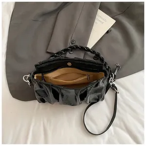 Minimalist black pleated cloud bag with glossy finish and thick chain handle for women