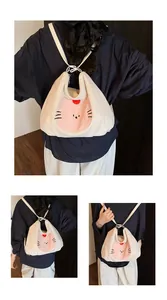 Detail of white corduroy tote bag with pink cat embroidery and slim shoulder straps