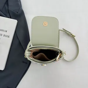 Minimalist light green PU leather mini crossbody bag with gold hardware and magnetic closure