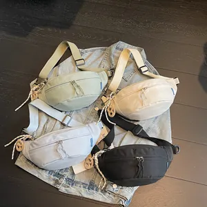 Japanese style crossbody chest bags for women and men in four pastel colors on denim