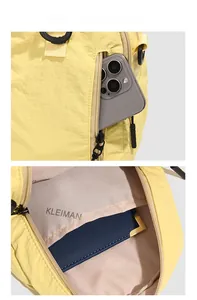 Detail view of yellow nylon bag showing functional exterior pocket and inner storage compartments