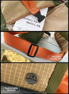 Detail view of adjustable strap, plastic buckle and front pocket on outdoor crossbody bag