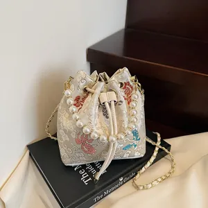 New Chinese style bucket bag with pearl handle and koi embroidery on white fabric