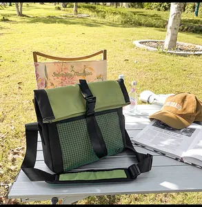 Outdoor leisure messenger bag detail with black green grid texture and buckle closure