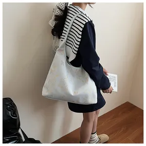 Lifestyle shot of large tote bag with elegant butterfly and bamboo print