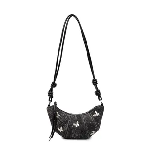 Borsa a mezzaluna in denim minimalista francese con farfalle d'argento e nodi decorativi