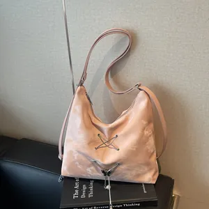 Pink marble texture tote bag with metal lace-up detail and pearl butterfly charm