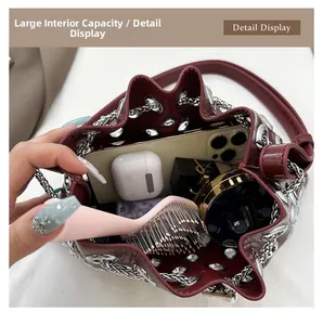 Top view of the burgundy bucket bag interior showing spacious capacity for daily essentials