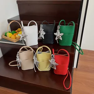 Chic pebbled leather mini bucket bags in six vibrant colors with star charms