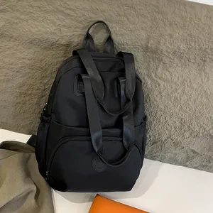 Waterproof black nylon backpack with multi-layer compartments and stylish round design