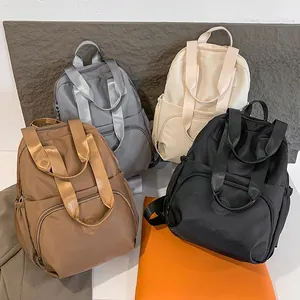 Waterproof nylon backpacks with multiple compartments in four stylish neutral colors