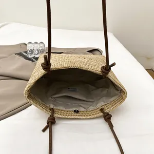 Large capacity woven straw tote bag with brown leather straps and magnetic closure