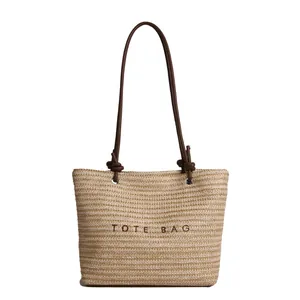 Large straw tote bag with brown leather straps and Tote Bag embroidery for summer beach