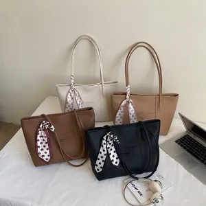 Large minimalist leather tote bag in four colors with decorative silk scarves