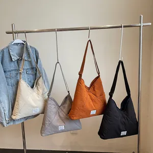 Minimalist Japanese canvas triangle tote bags in four colors with adjustable straps