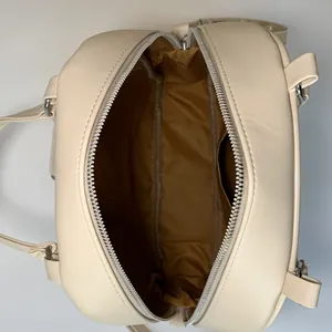 Beige tote bag with large capacity showing camel fabric lining and double zipper closure