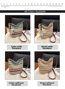 Detail of colorful striped straw bucket bags with brown leather straps and flower charm