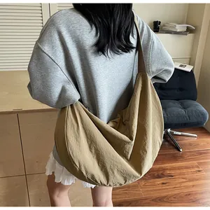 Detailed back view of a khaki large-capacity nylon hobo shoulder bag for daily commuting