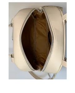 Top view of cream tote bag showing spacious brown fabric lining and inner zipper pocket