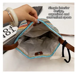 Detail of the woven bucket bag featuring a secure magnetic closure and grey fabric lining