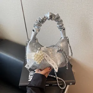 Silver crescent pleated handbag with pearl heart charm and chain strap for women
