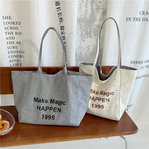 Striped and cream canvas tote bags with Make Magic Happen print for daily travel