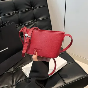 Trendy Lychee Grain PU Leather Bucket Bag For Women Fashion Letter Embossed Shoulder Crossbody Bag With Metal Heart Charm
