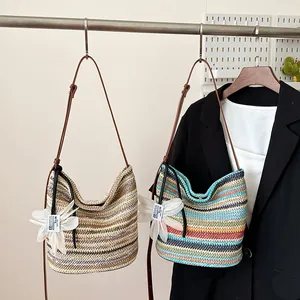 Rainbow striped straw shoulder bags with floral charms for 2025 summer fashion style