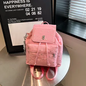 Pink canvas backpack with silver star print, drawstring closure and metal G logo