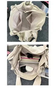 Detailed interior of the beige canvas tote showing the zipper pocket and large capacity