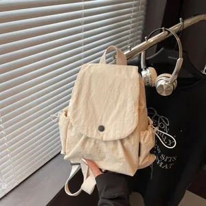 Minimalist beige nylon flap backpack for women with large capacity and drawstring side pockets