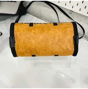 Detailed top view of the yellow cylinder crossbody bag with unique crinkle texture finish