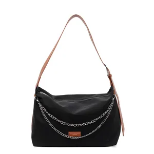 Black large capacity nylon tote bag with silver chain and brown leather strap details