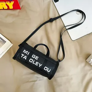 Chic black cylinder crossbody bag with white letter print and adjustable nylon strap