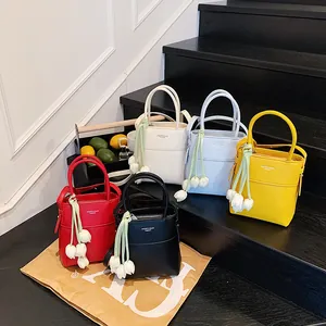 Mini PU leather bucket handbags in five vibrant colors with tulip flower charms