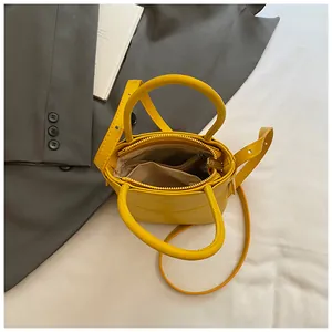 Mini bright yellow PU leather crossbody handbag with top handles and adjustable strap