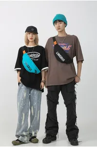 Detail of waterproof oxford chest bags with LINGRUI logo worn by street style models