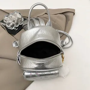 Silver mini backpack with metallic crinkle texture and floral pocket for women