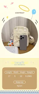 Compact cream nylon crossbody bag size comparison with a smartphone on desk