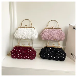 Close-up of four evening clutch bags with 3D rose fabric and pearl accents in a grid