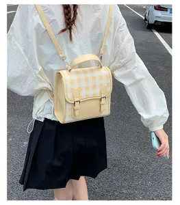 Mini yellow and white checkered backpack shown on model for small-sized casual style